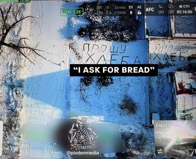 A Ukrainian woman near the frontline wrote “I ask for bread” into the snow