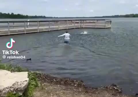 Swimming with all his might. And yet ?
