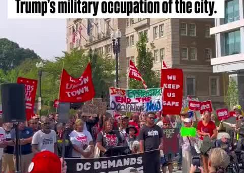 DC residents gather to condemn one year of Trump’s military occupation of the city. The…