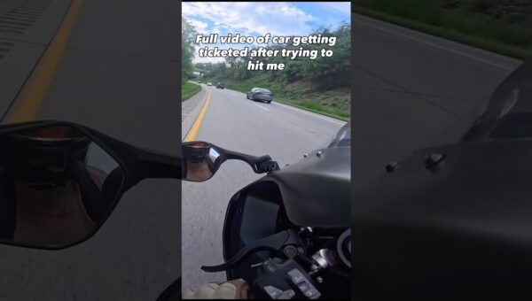 Car tries hitting biker and gets instant karma
